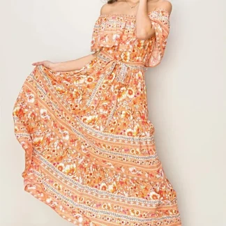 Vestido longo floral elegante com ombros à mostra e detalhe de amarração frontal para ocasiões especiais.